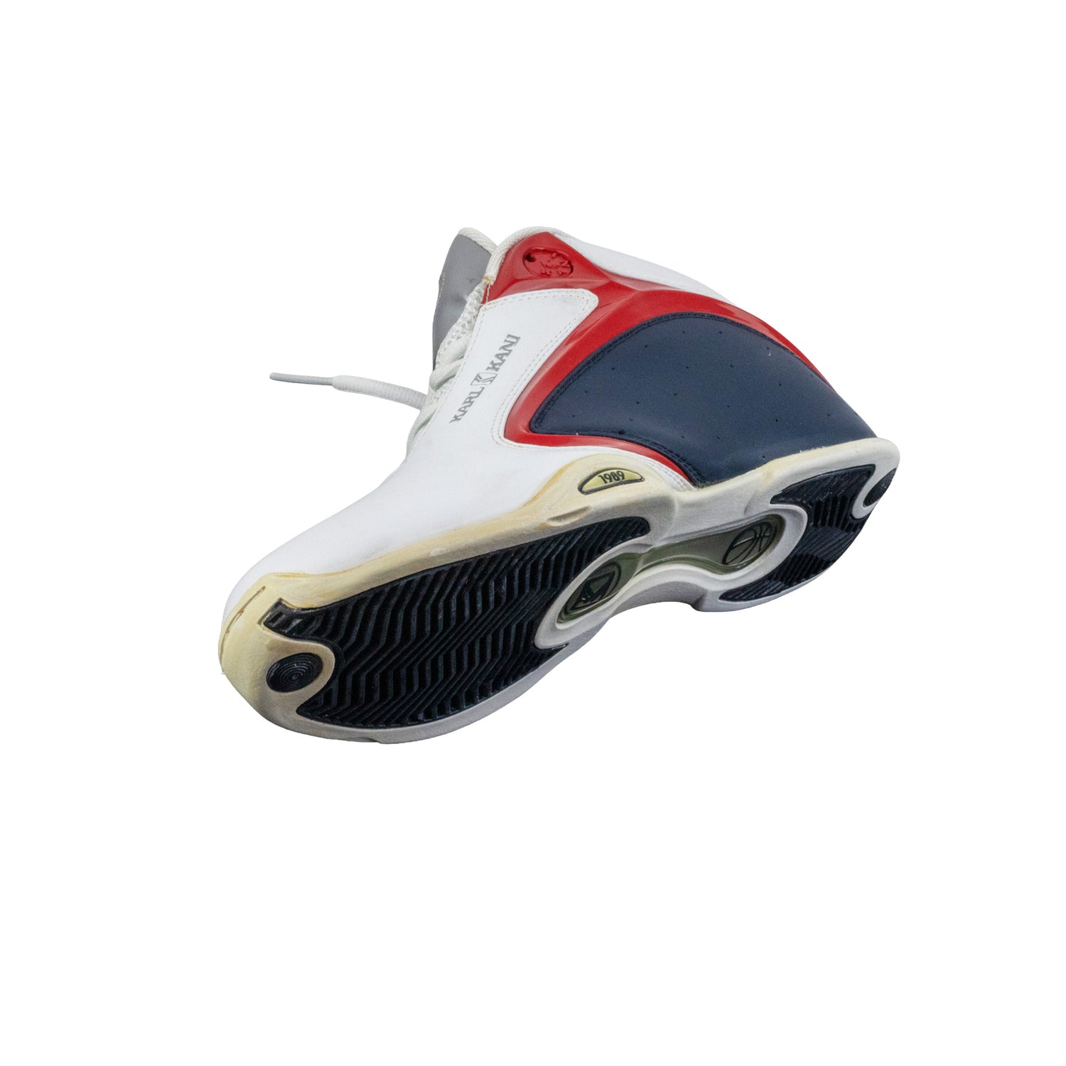 Basketball shoe with white, red, and blue design on a white background