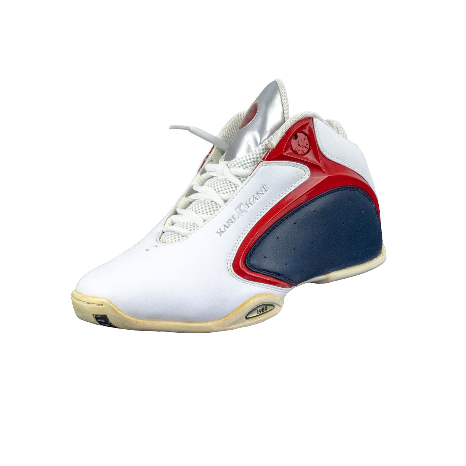 White sneaker with red and blue accents on a white background