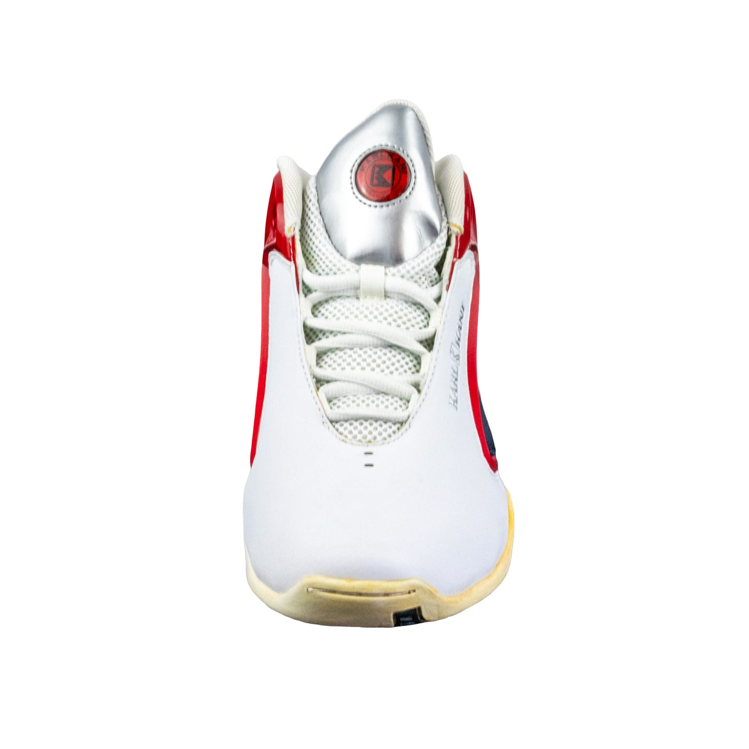 White sneaker with red accents on a white background
