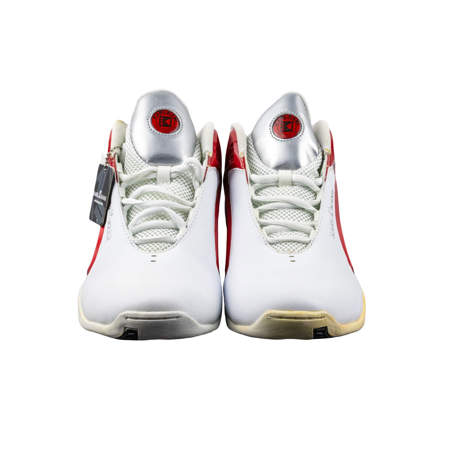 White sneakers with red accents on a white background