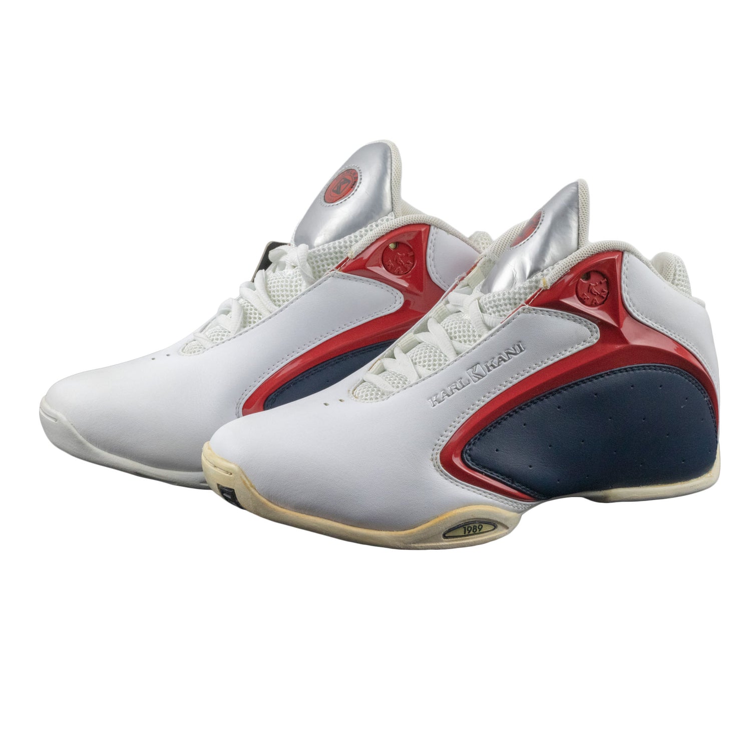 White sneakers with red and blue accents on a white background