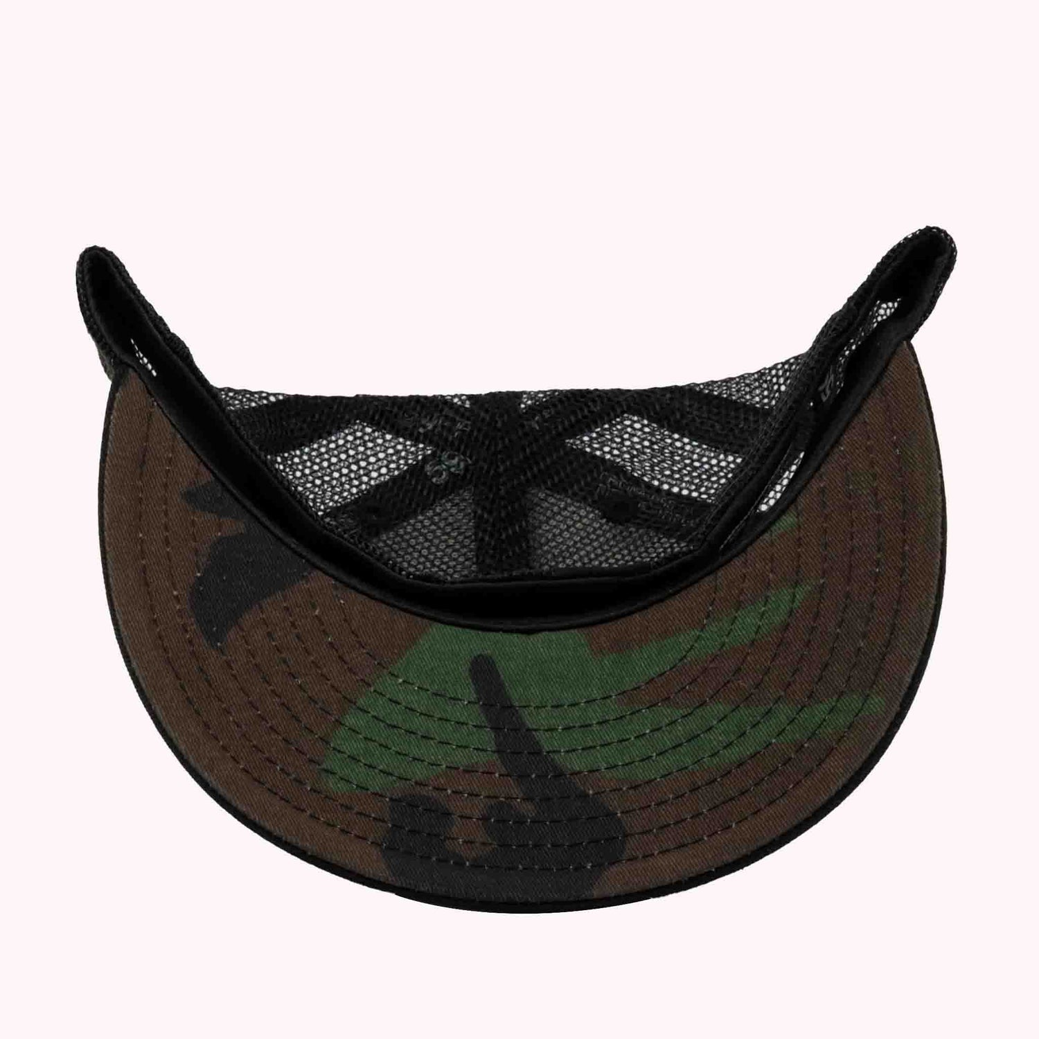Camouflage visor with black mesh on a white background