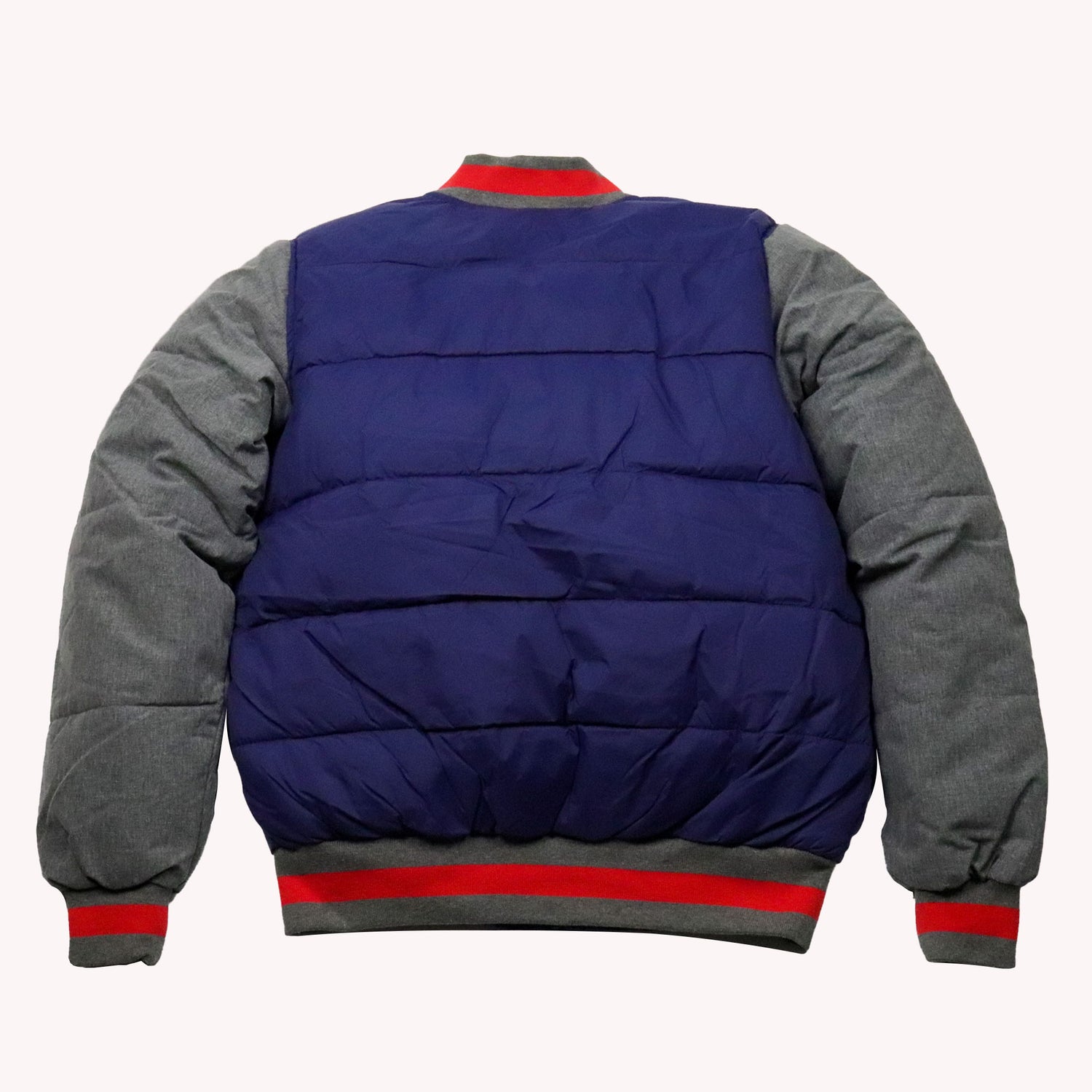 Blue and gray puffer jacket with red accents on a white background