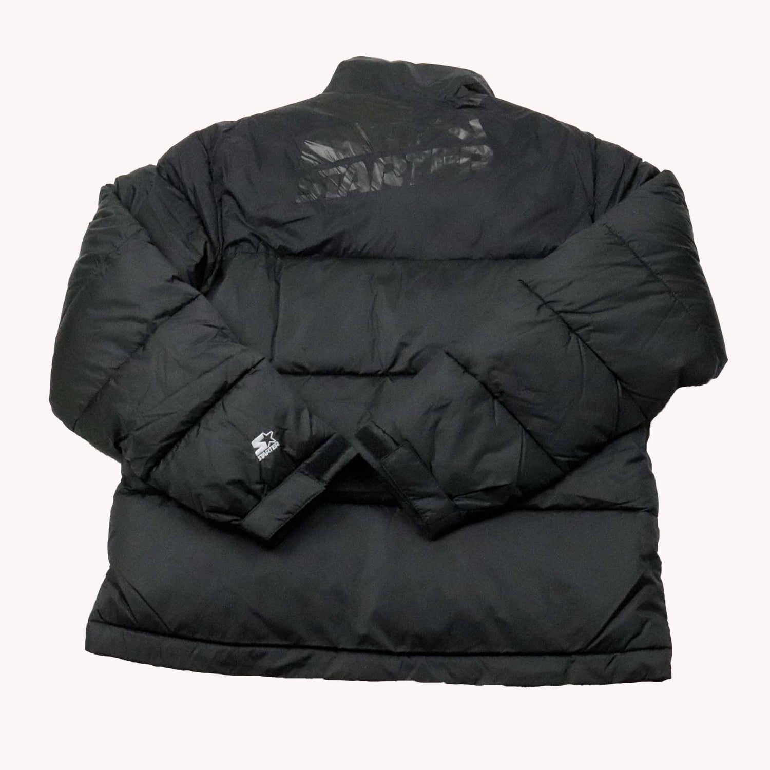 Black puffer jacket with visible branding on a white background