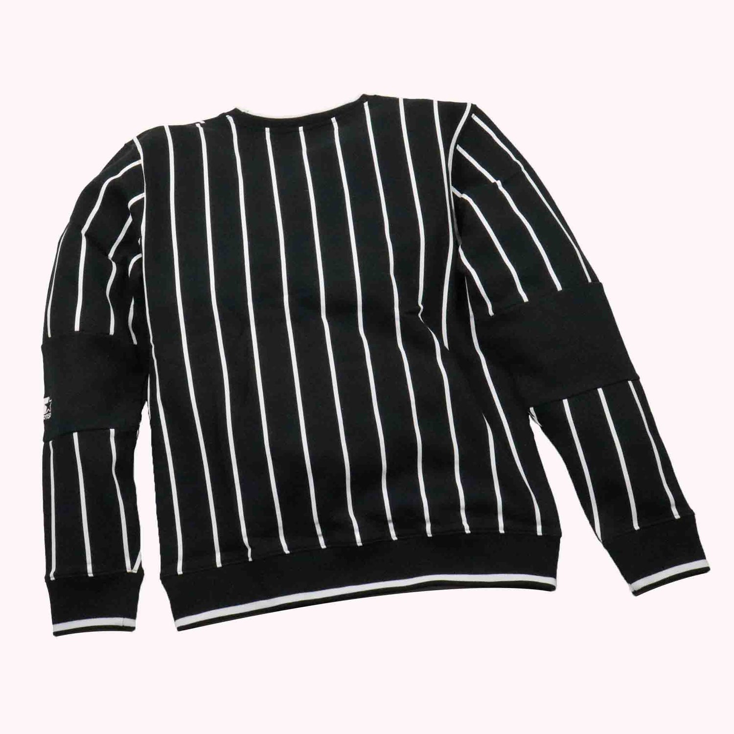 Black sweater with white vertical stripes on a white background