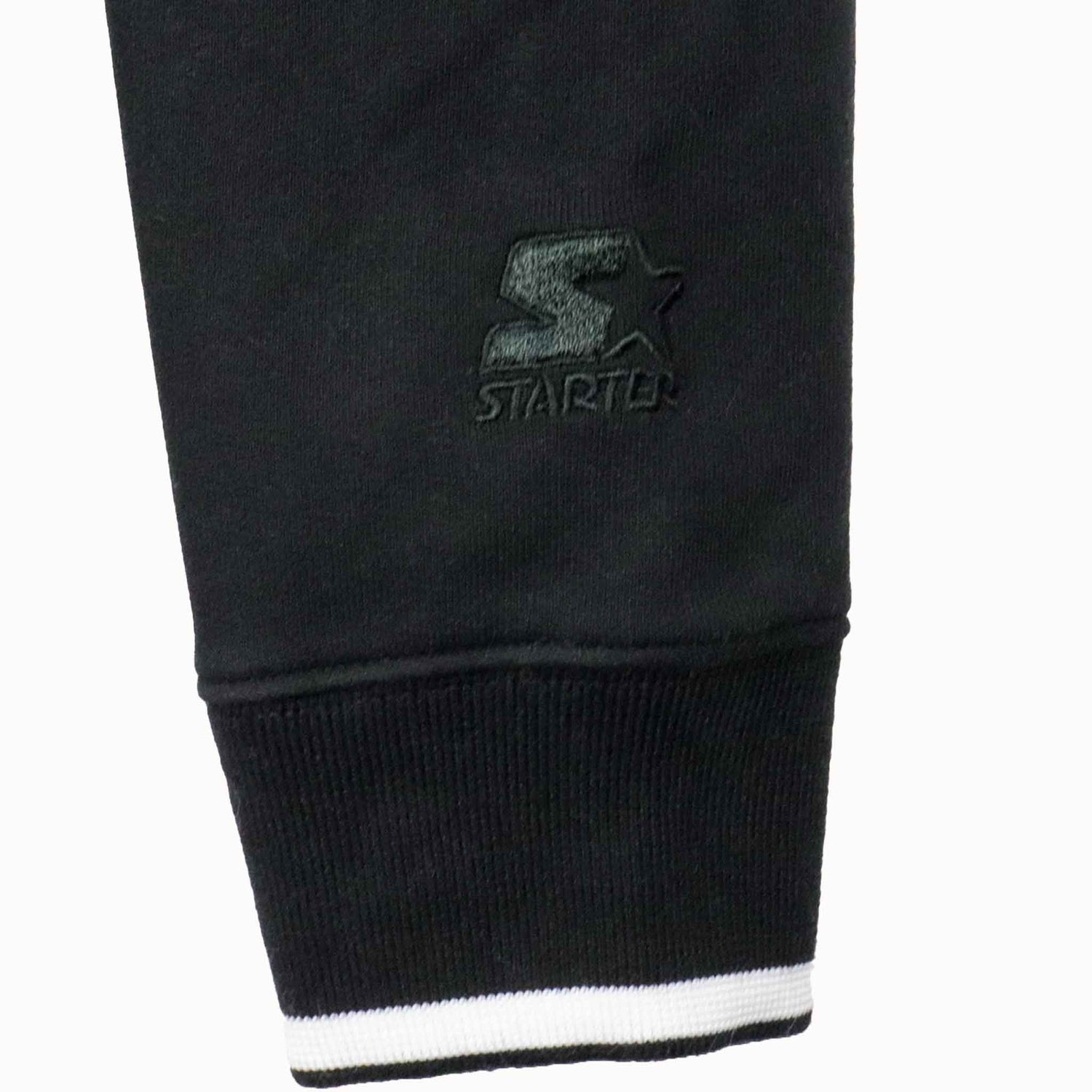 Black sweatpants with Starter logo on a white background