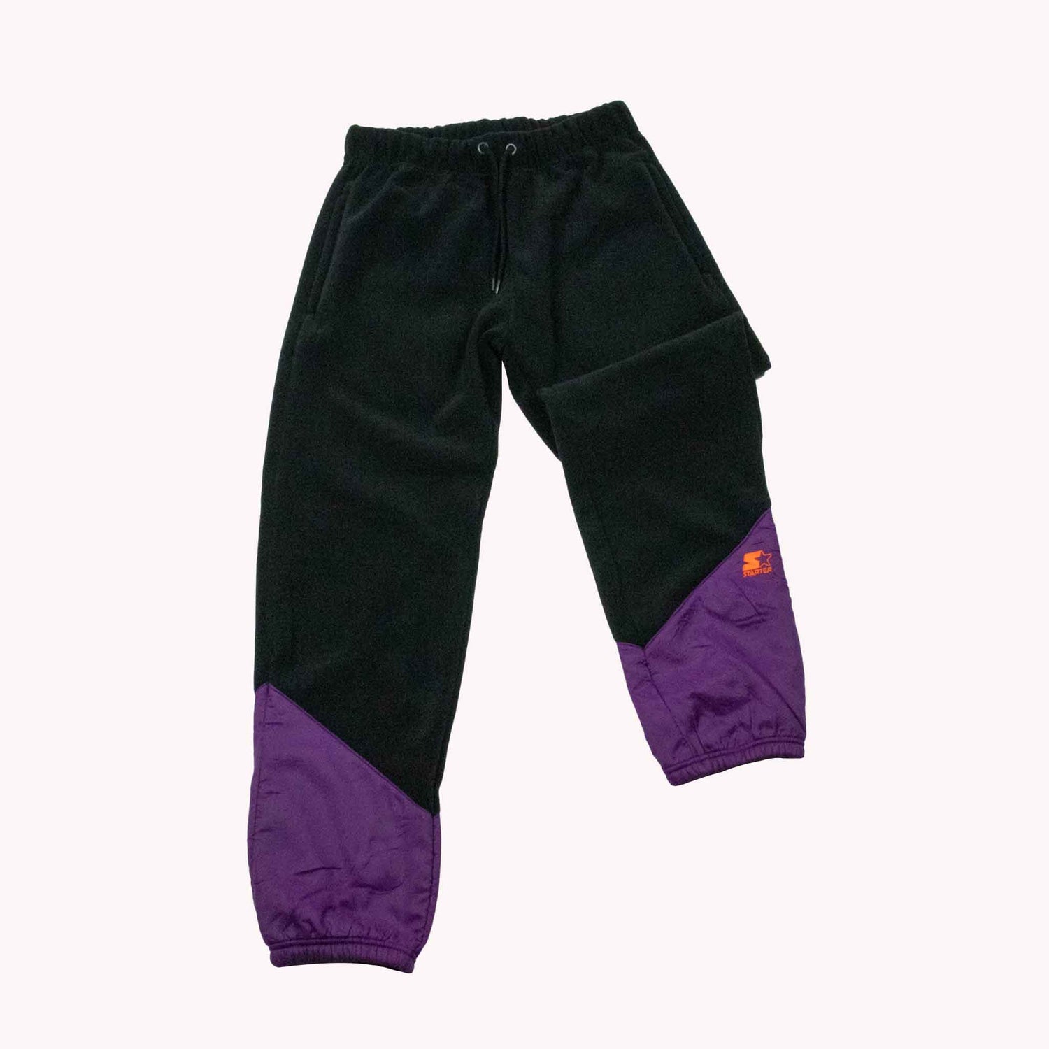 Black and purple pants with a Starter brand logo on a white background