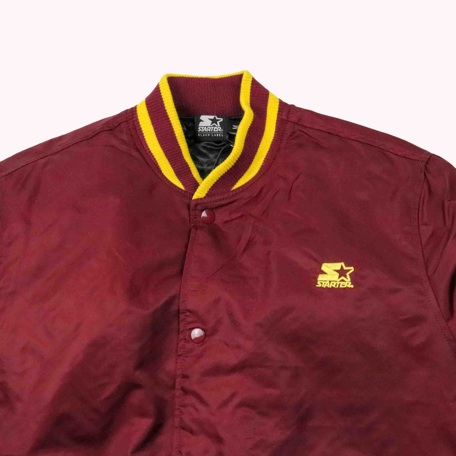 Maroon jacket with yellow trim and Starter logo on a white background