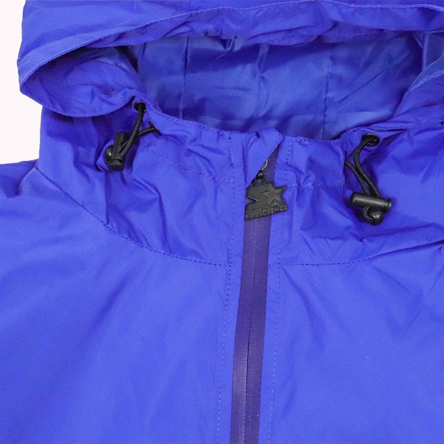 Close-up of a blue jacket with a zipper and hood on a white background