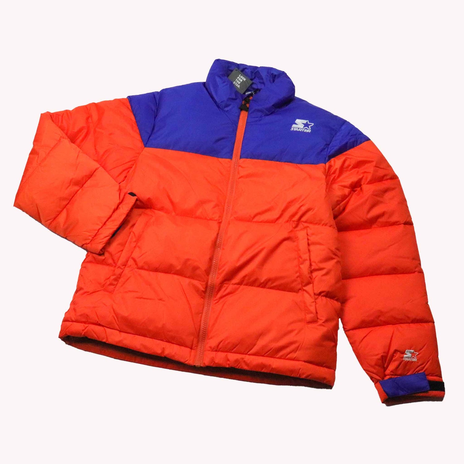 Orange and blue puffer jacket on a white background