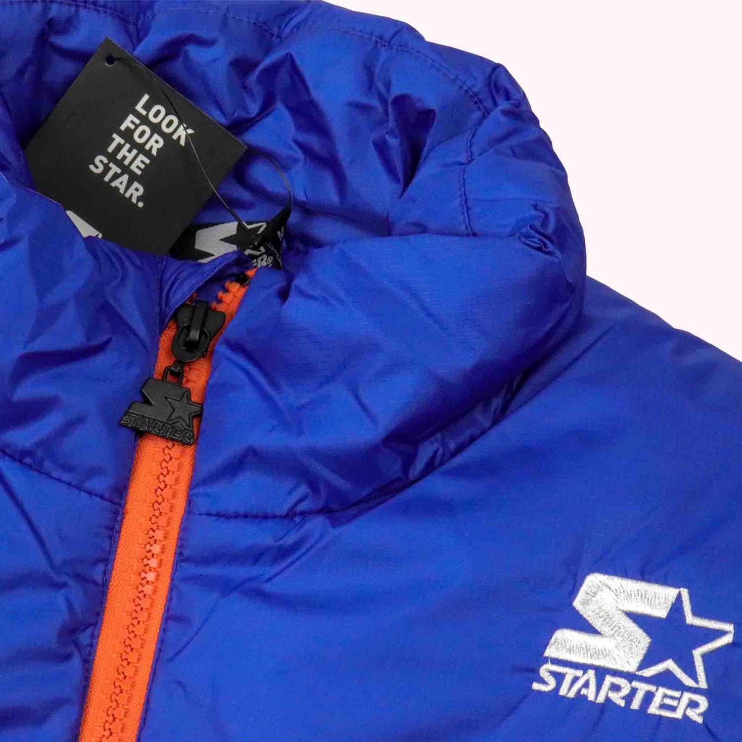 Blue jacket with orange zipper and Starter logo on a white background