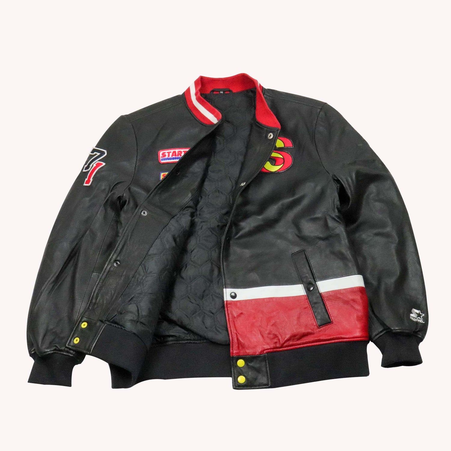 Black and red jacket with colorful designs on a white background