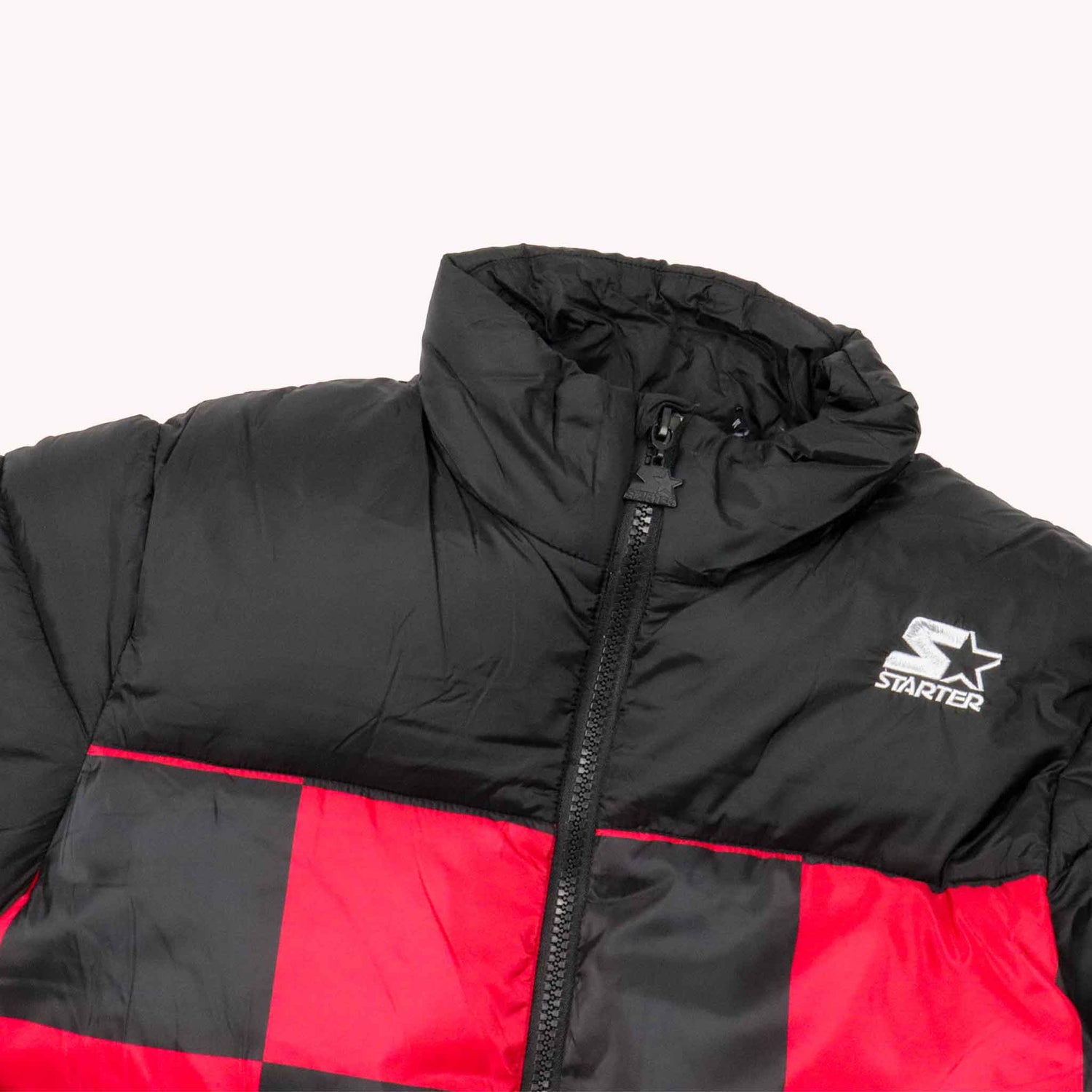 Black and red puffer jacket with Starter logo on a white background