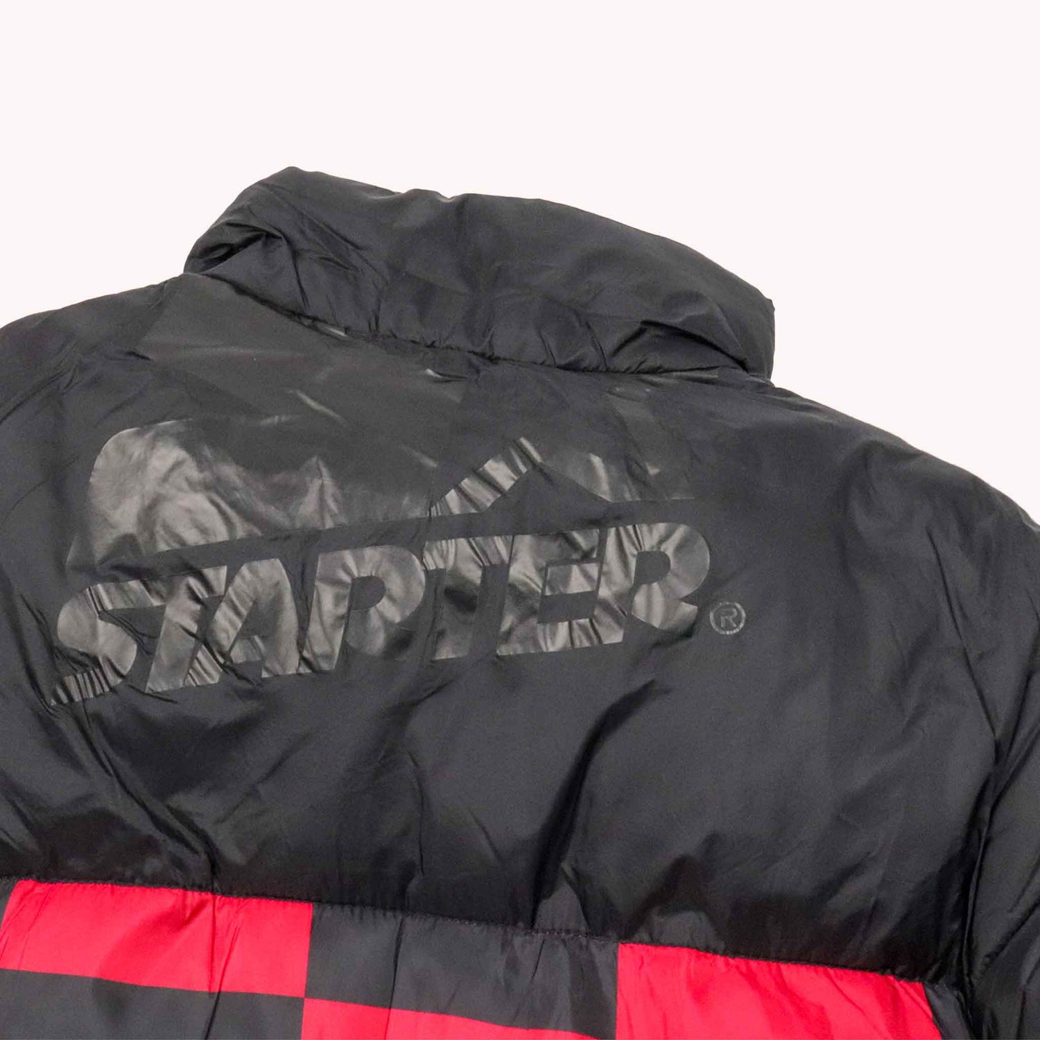 Black puffer jacket with 'Starboard' logo on a white background