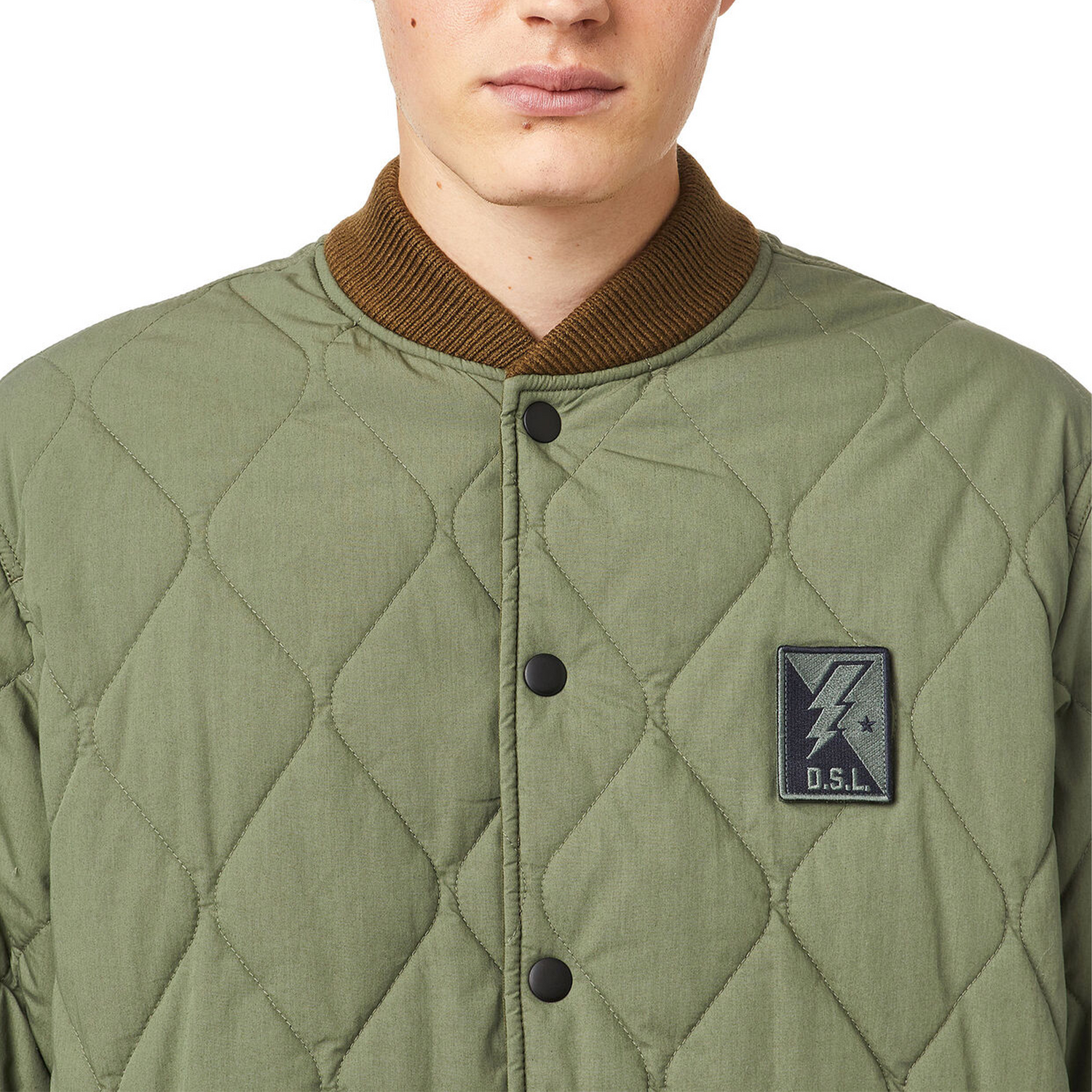 Diesel J-Foot Reversible quilted coach jackets. A clean close Camera view with a DSL badge 