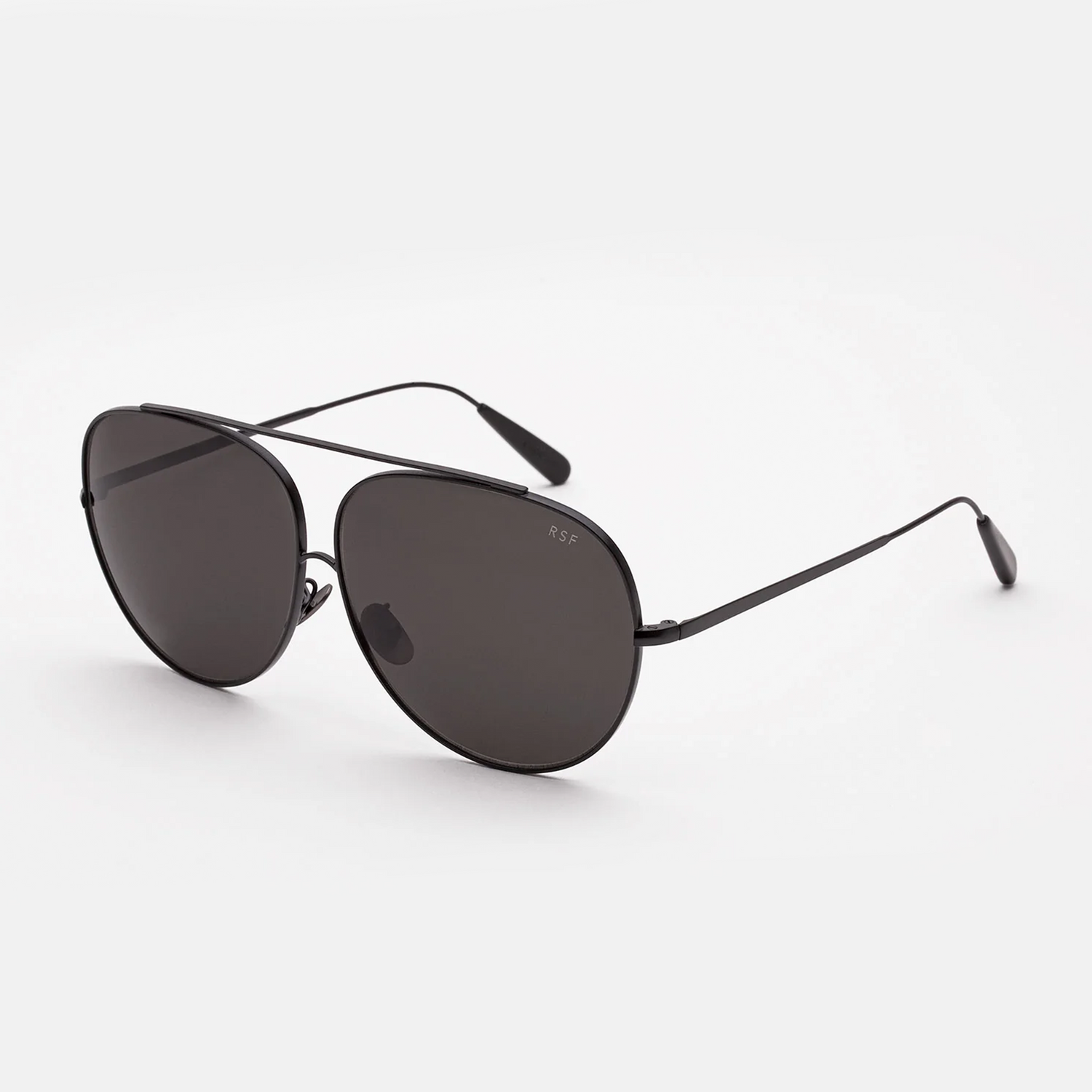 A pair of black matte sunglasses with a square full frame design and a visible hinged bridge.