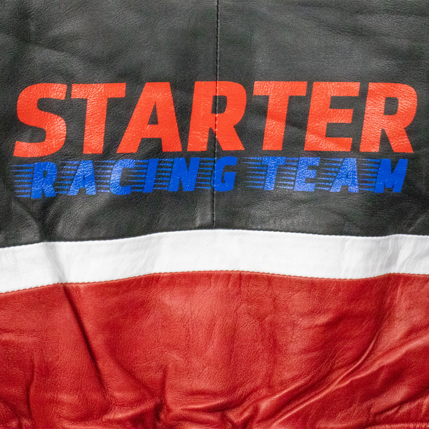 Starter Black Label Racing Leather Jackets. Camera Close View of the print on the Vintage Black, White and Red Leather